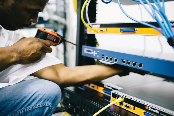 electrician working on computers.webp